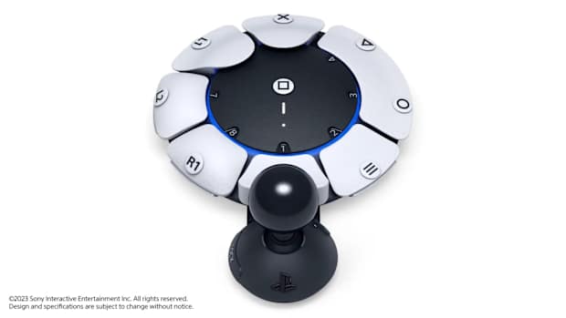 A futuristic looking hardware component with buttons and a stick.